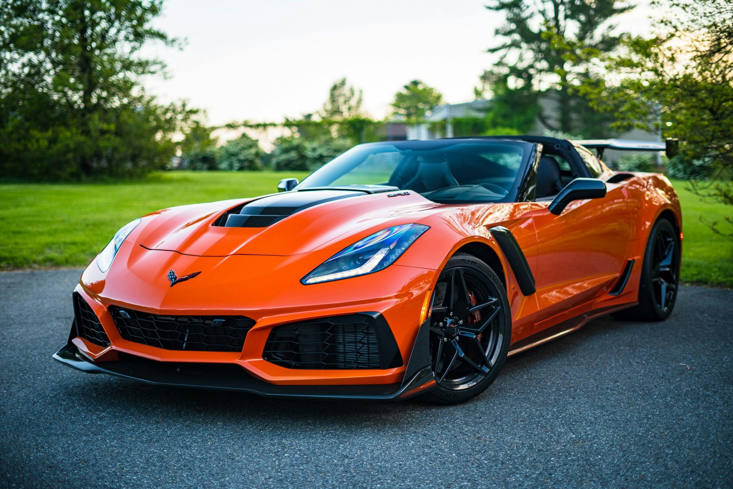 Bright orange Corvette sports car with a sleek and polished finish, showcased after expert car detailing and ceramic coating services in Lake Norman, NC, highlighting luxury vehicle care and protection.