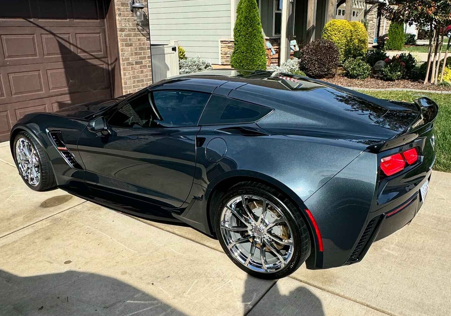 Detailed black Corvette with flawless reflections on its surface, highlighting premium car ceramic coating and automotive ceramic coating services in Lake Norman.