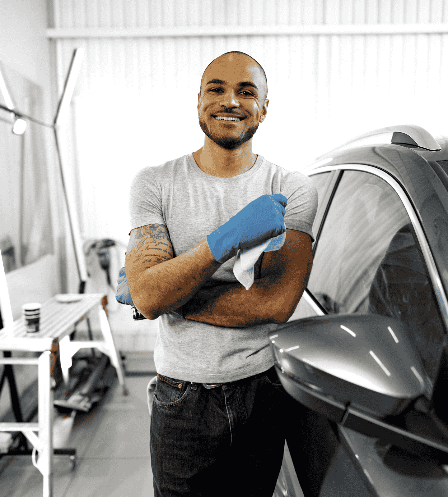 Expert mobile detailer in Lake Norman, NC, smiling confidently while showcasing professional car detailing services, specializing in premium vehicle care and restoration.